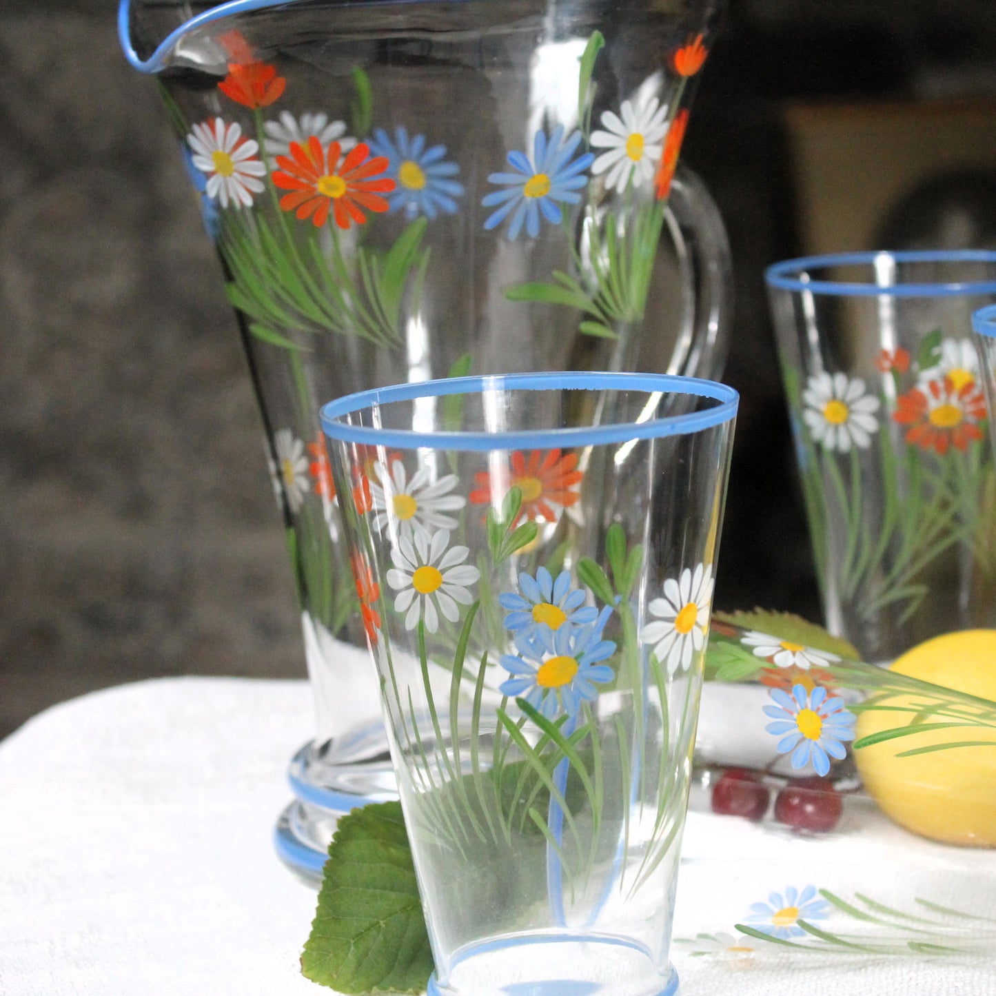 Clear glasses with floral designs on a table