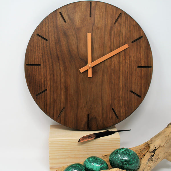 round walnut wall face with copper hands