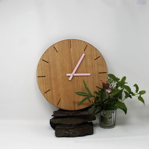 Solid oak round wall clock with baton marks and pink metallic hands