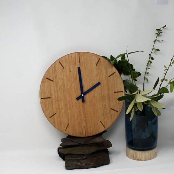 wooden wall clock with dark blue, navy blue hands