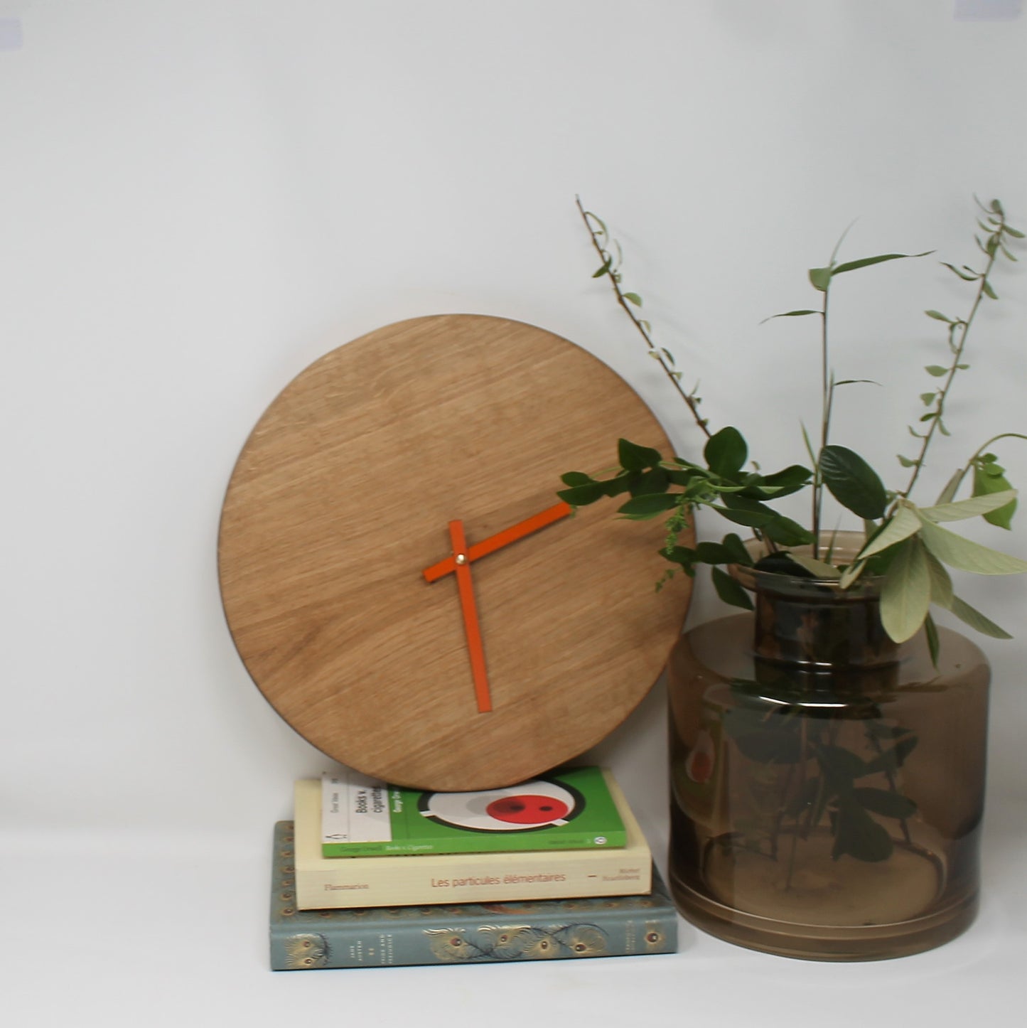 japandi clock with no numbers and orange hands
