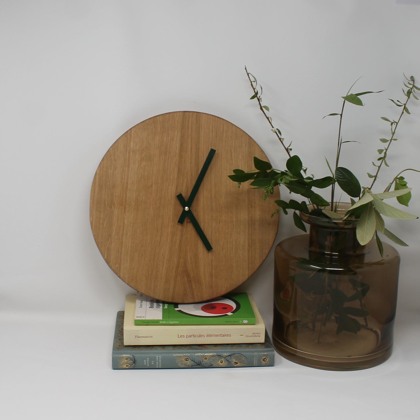 analog oak wall clock with dark green hands
