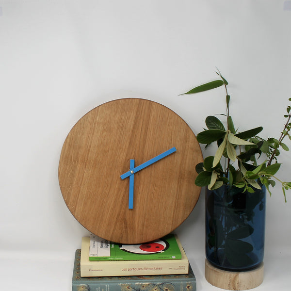 oak wall clock with minimalist face no numbers turquoise hands