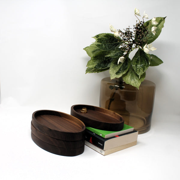 Stackable dark wood oval tray