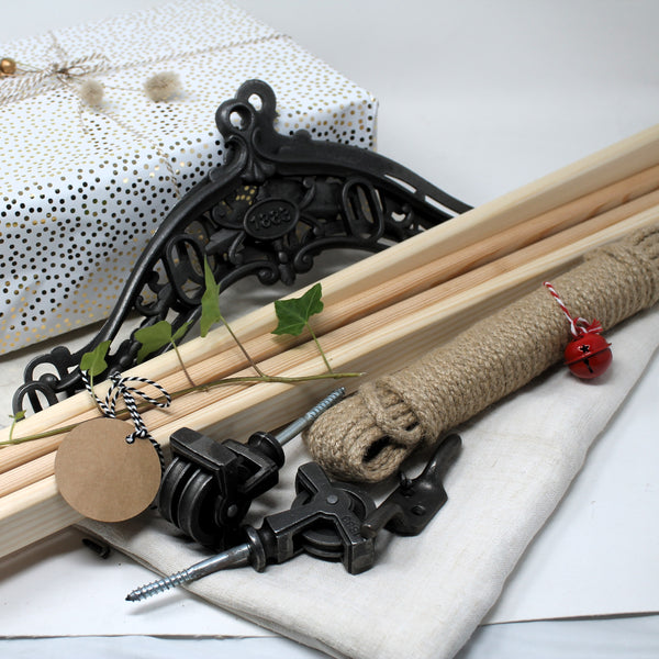 Victorian-style laundry drying rack components with polished timber rails, rustic metal fittings, and natural cotton rope — perfect for period homes.