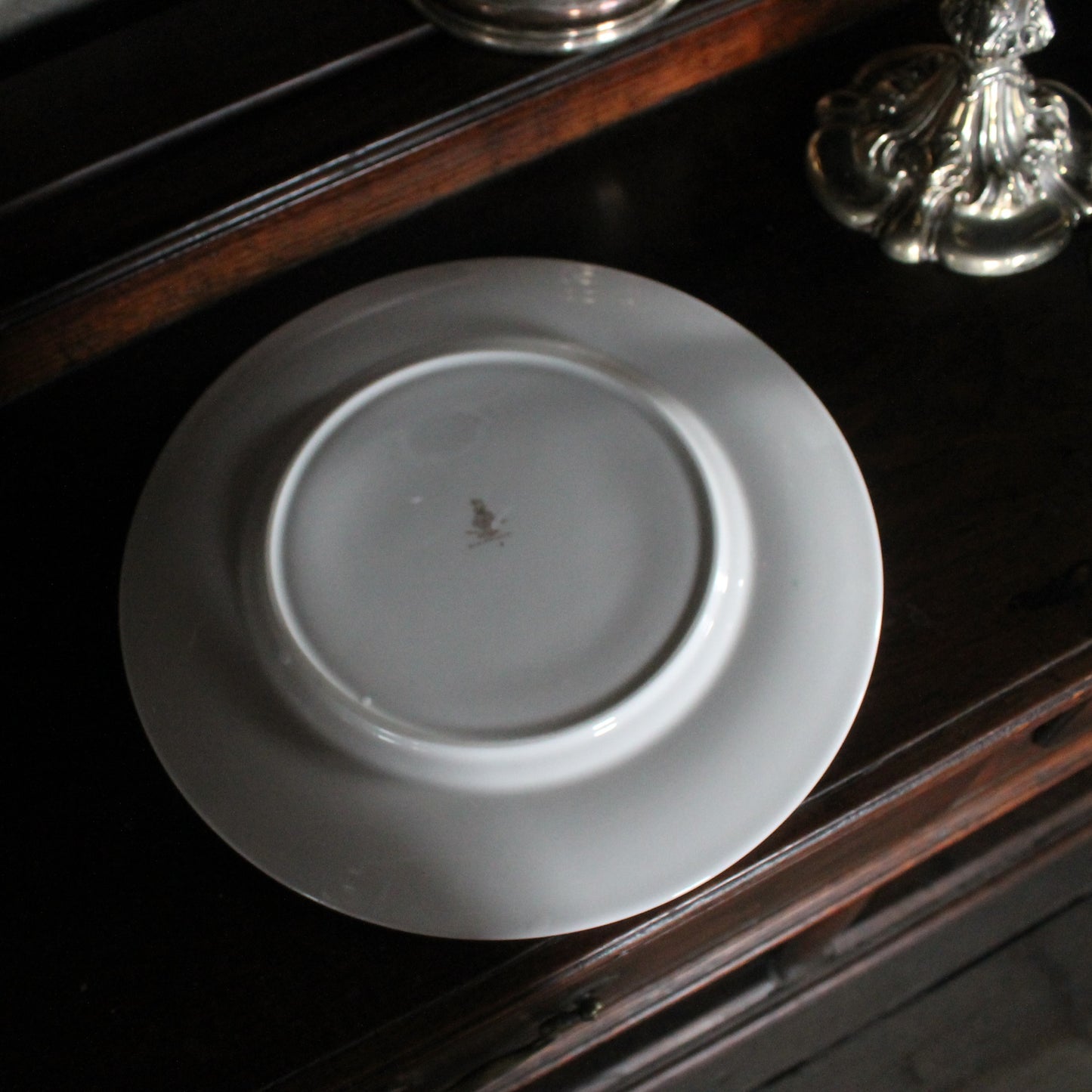 Back of a Royal Doulton Biltmore China plate on a wooden dresser
