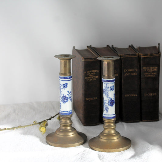 vintage brass candlesticks with books in the background