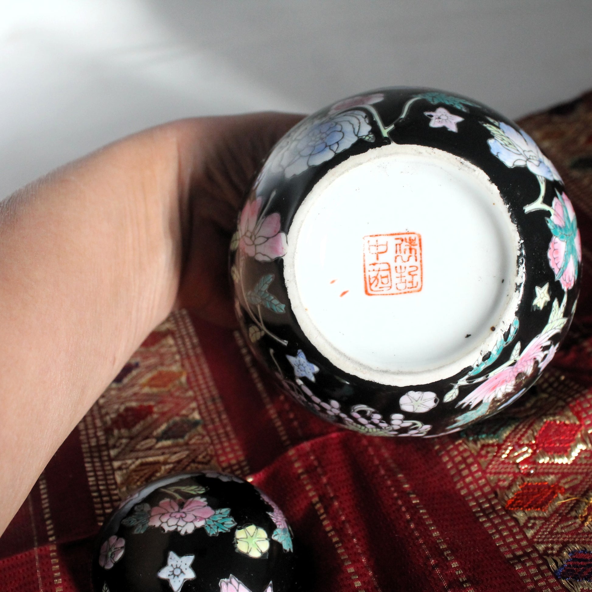 Chinese porcelain stamp on the bottom of a famille noire ginger jar