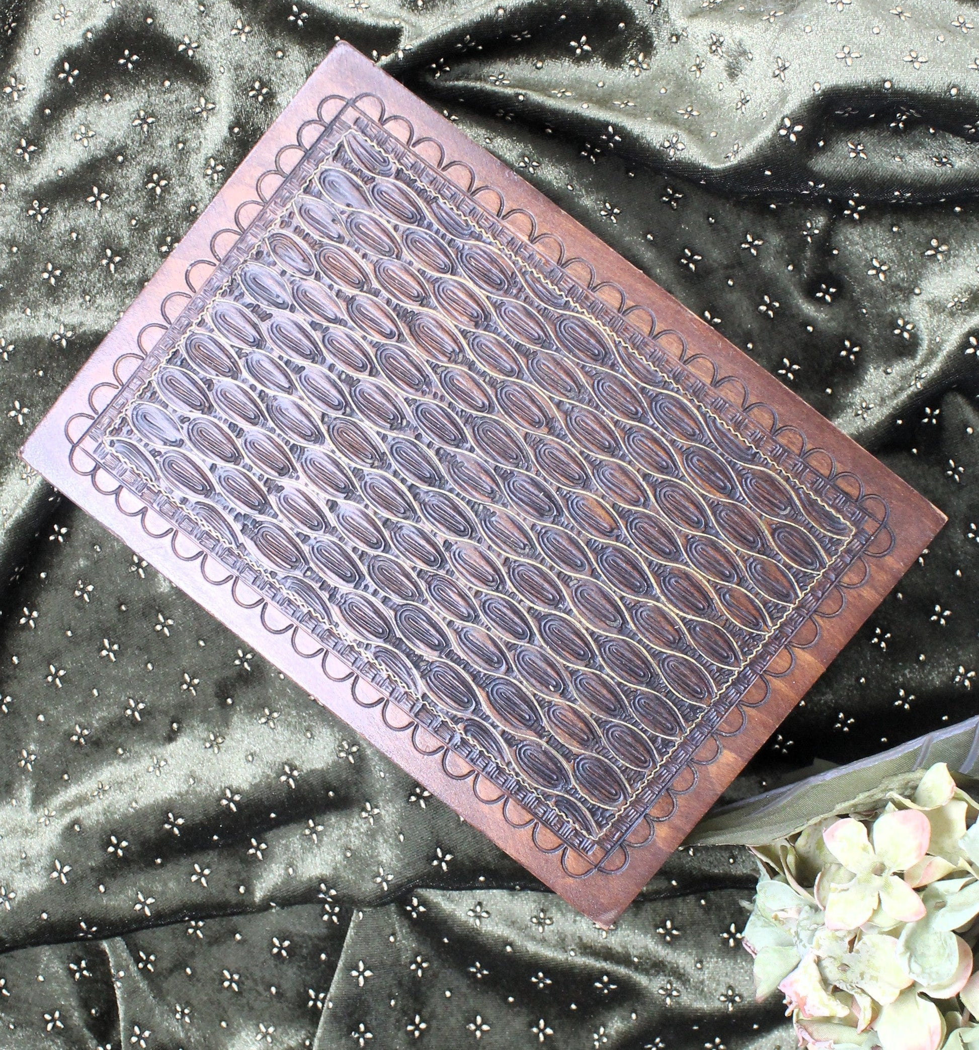 Decorative vintage Jerusalem box  with geometric pattern on a textured fabric background