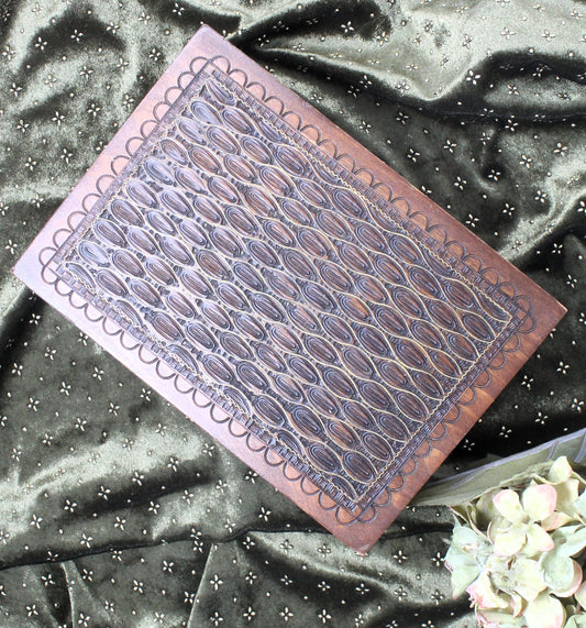 Decorative vintage Jerusalem box  with geometric pattern on a textured fabric background