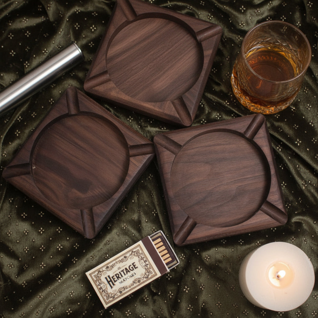 Three dark brown wooden coasters with a circular center and angled raised edges, arranged on a shiny olive green fabric background with white decorative flowers.