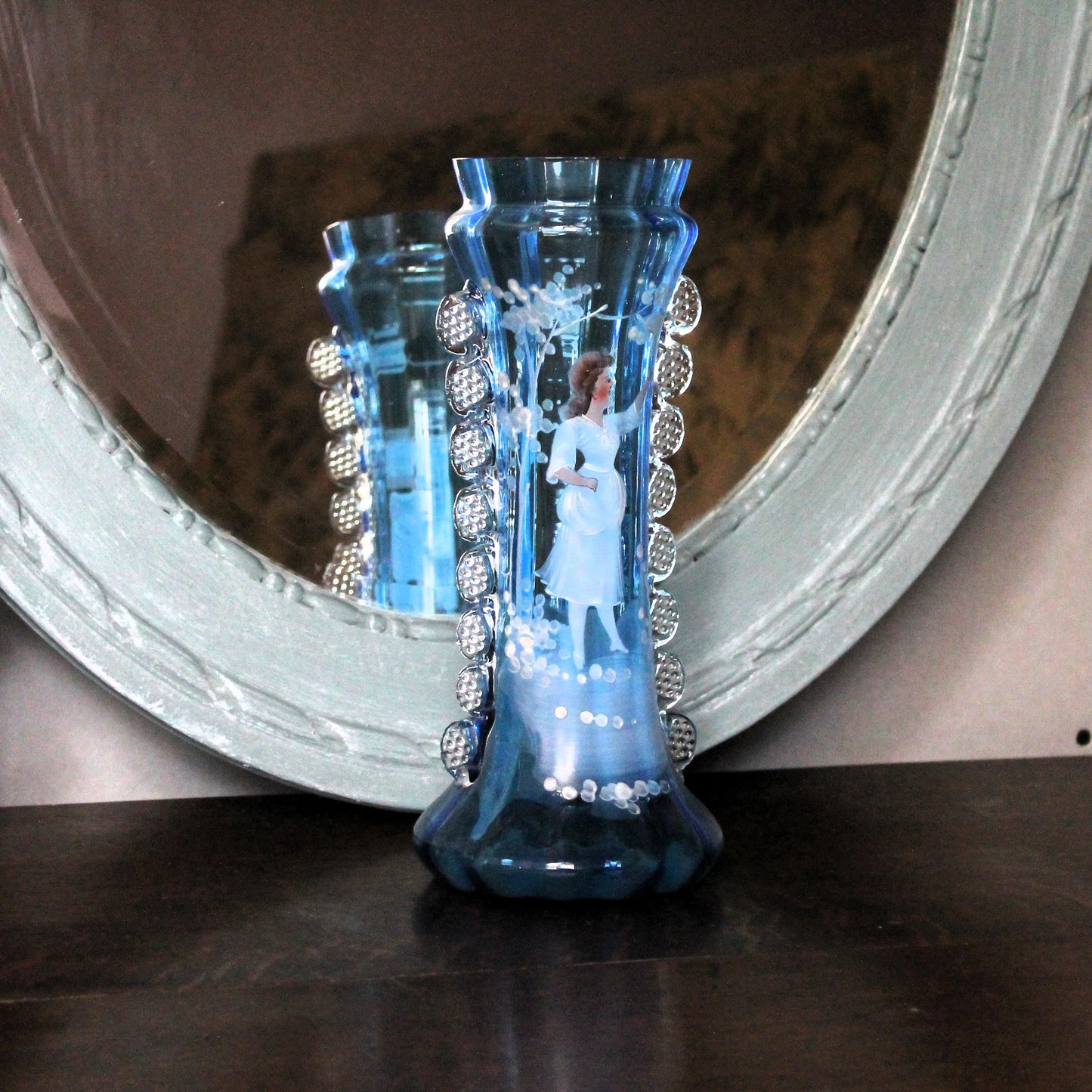 Mary Gregory vase with enamel painted girl in front of a bleu mirror