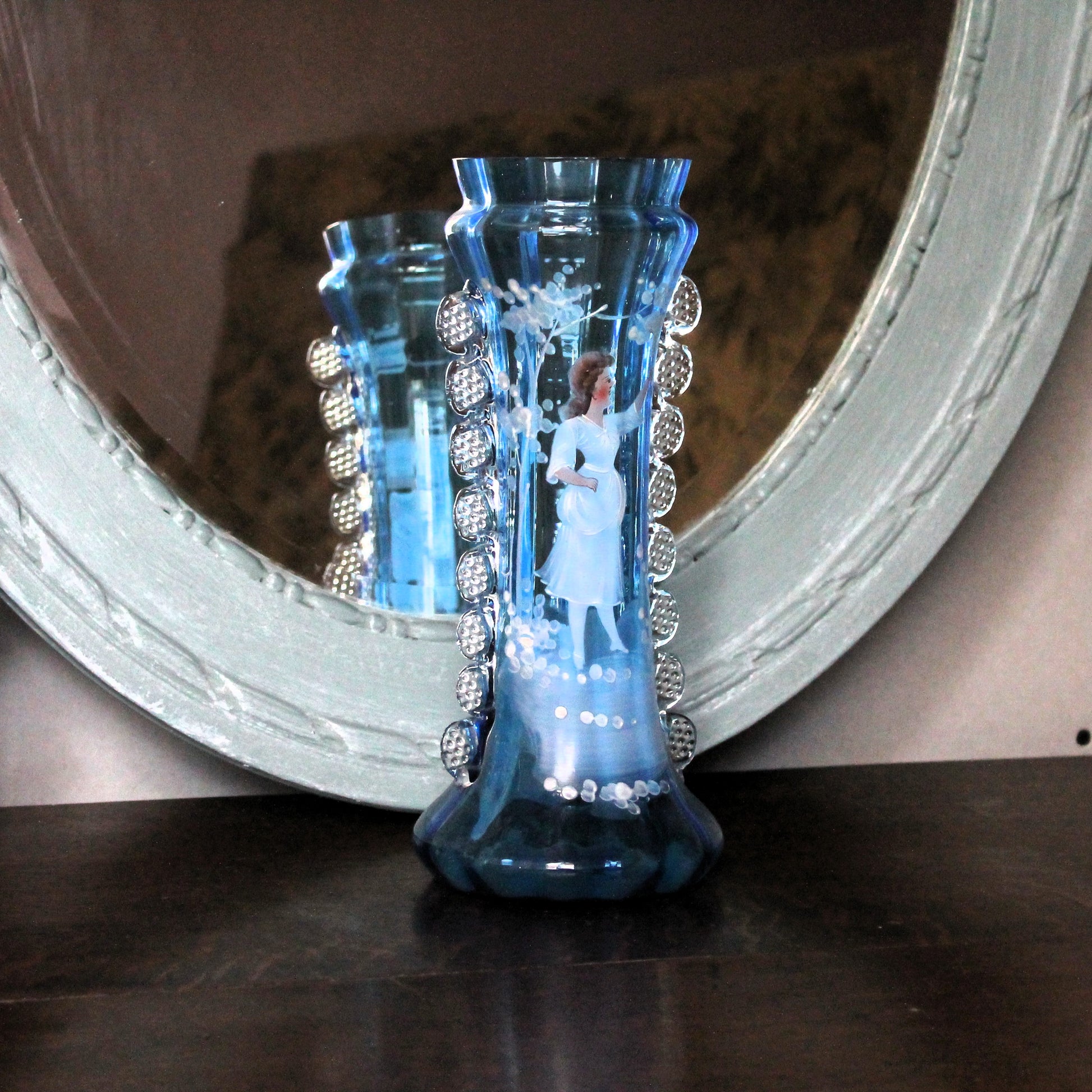 Mary Gregory vase with enamel painted girl in front of a bleu mirror