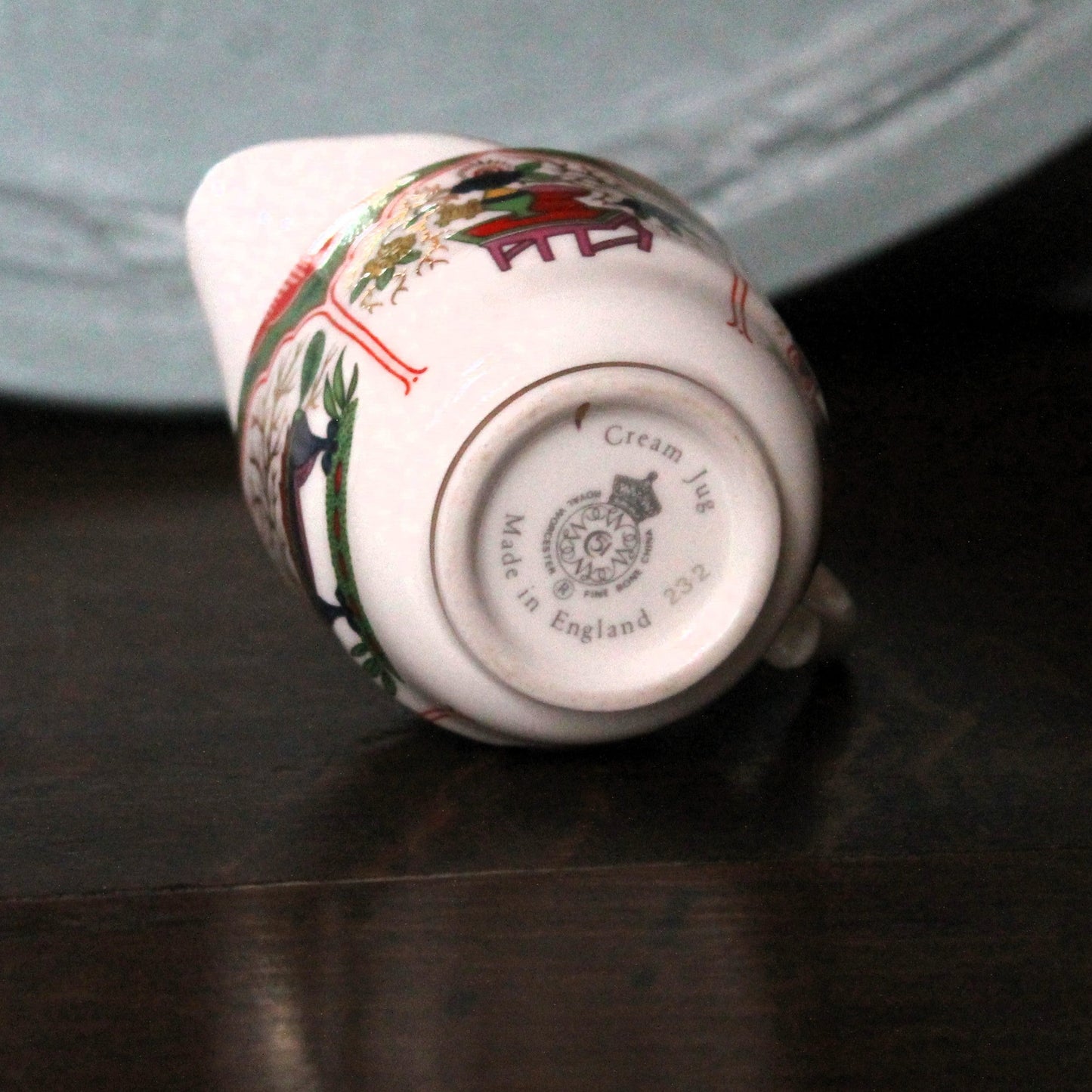 Underside of a miniature Royal Worcester milk jug showing stamp marked Cream Jug and serial number 232