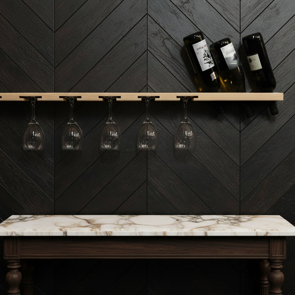 A light wood wall-mounted wine rack with black clips holding four clear wine glasses upside down on the left and three dark wine bottles on the right, mounted against a plain black wall.