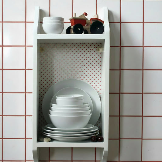 white kitchen storage hand painted wooden shelf, shown with a toy tractor and fruit on the ottom shelf